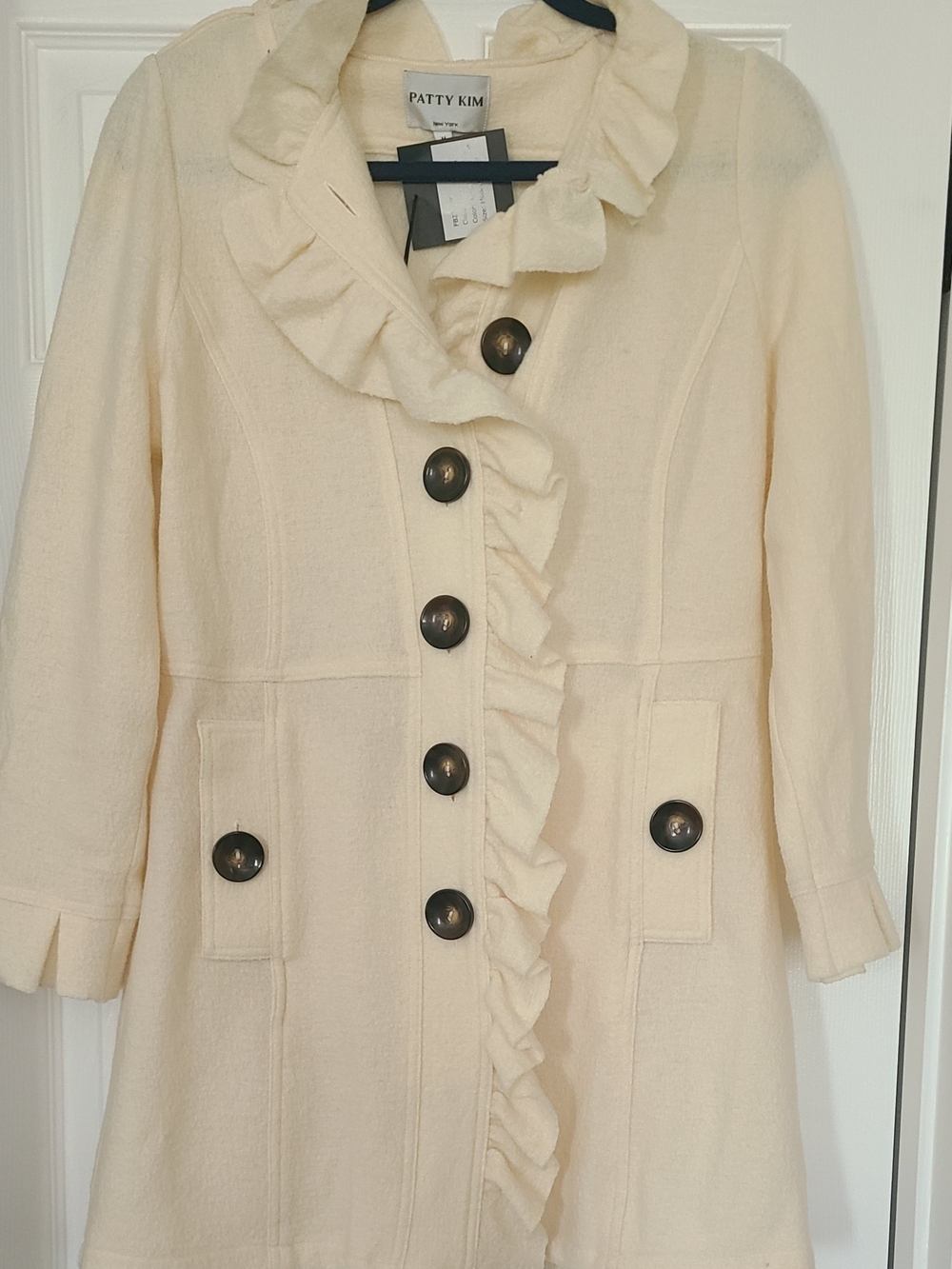 New With Tags.  Beautiful PATTY KIM Cream Coat with Dark Accent Buttons.